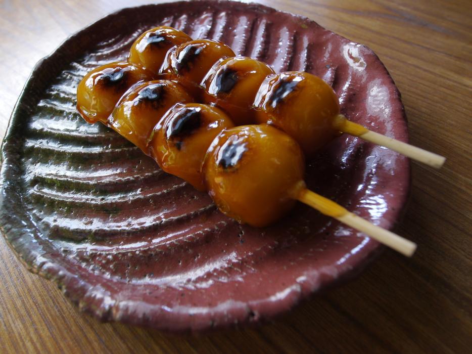 Mitarashi Dango, traditional Japanese rice dumpling skewered on a bamboo stick