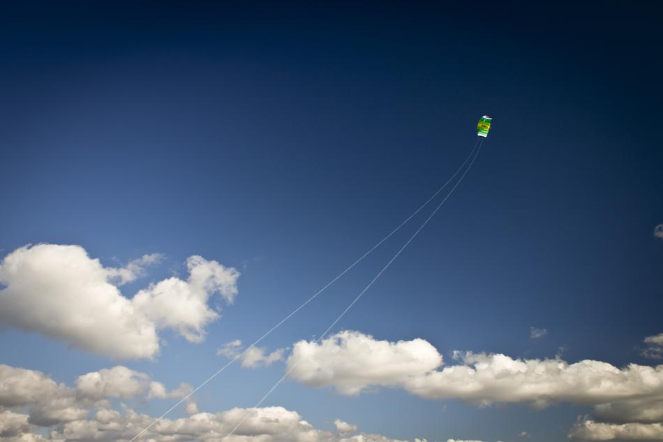 kite flying above the clouds