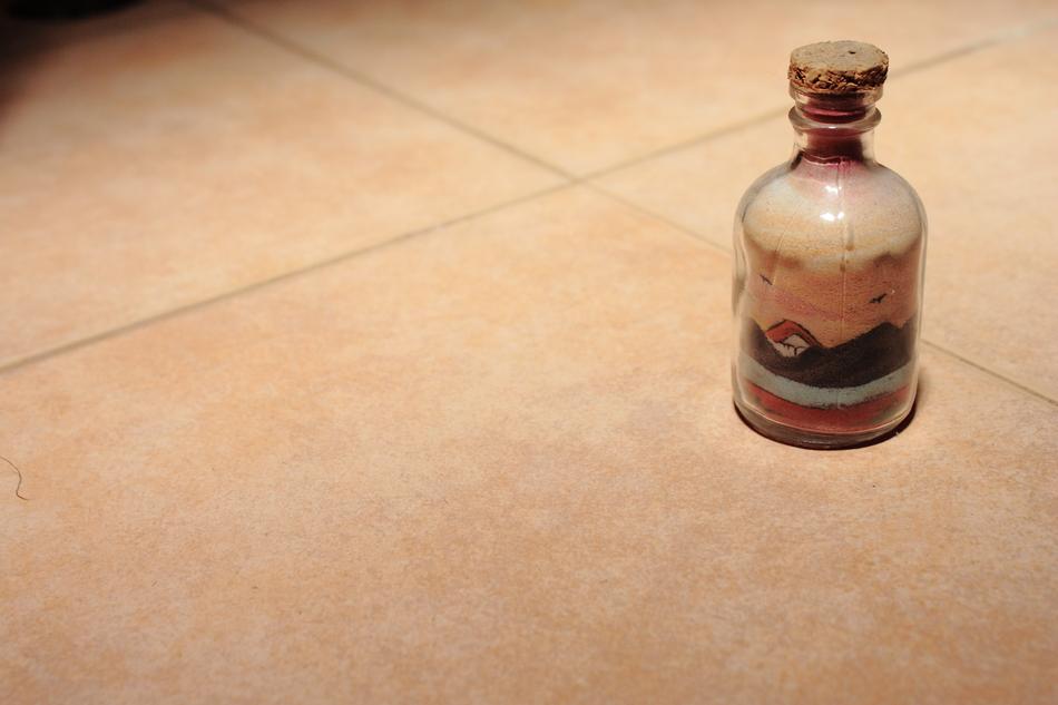 Beautiful and colorful bottle with trim, on the floor