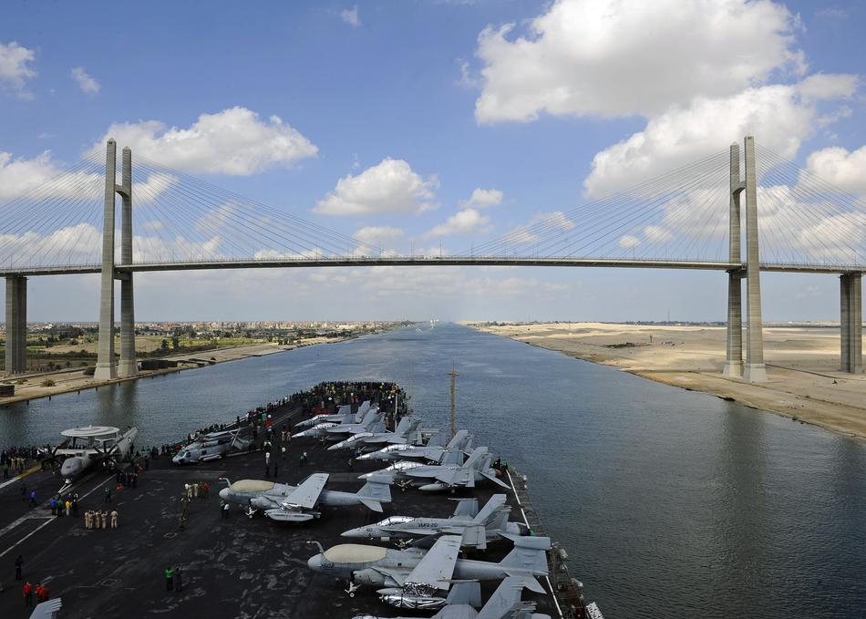 Bridge above the Suez Canal, among the colorful fields
