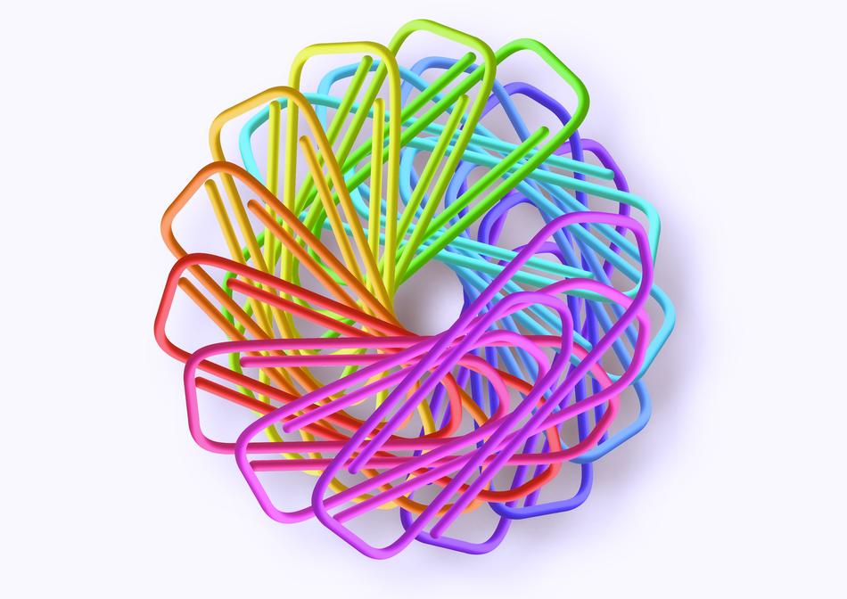 Beautiful and colorful paperclips at white background