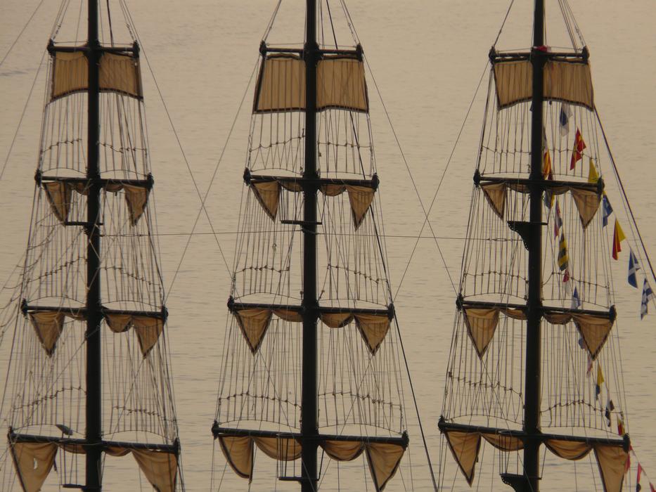 photo of three masts of the ship