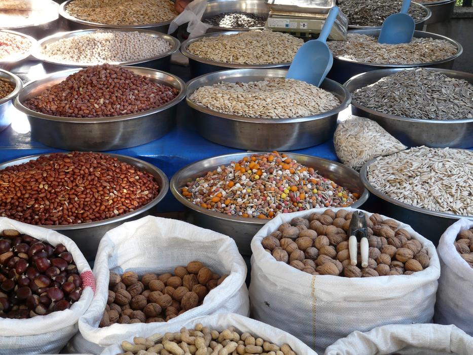 Colorful and beautiful nuts and seeds in the bags, on the market