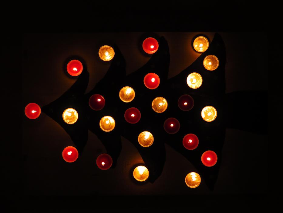 copper and red christmas candles in the dark