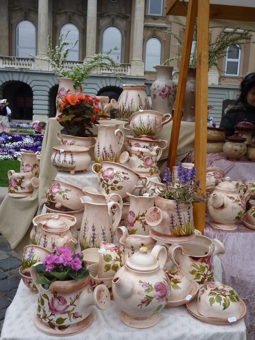 Beautiful and colorful, patterned ceramic tableware near the building with windows