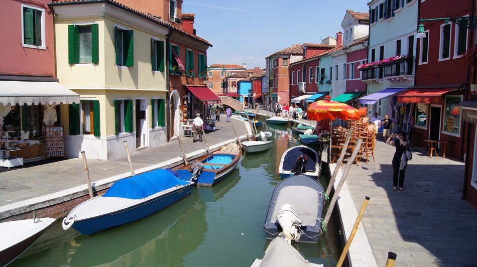 boats moored on Channel along street, italy, Burano