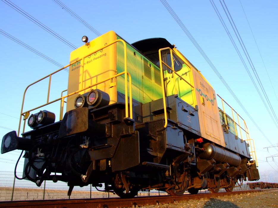 Colorful train on the railroad in Rotterdam, Netherlands, on the landscape