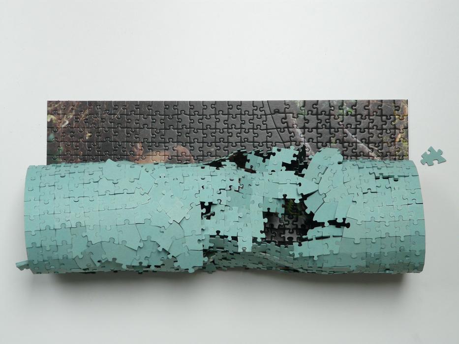 rolled up picture of puzzles