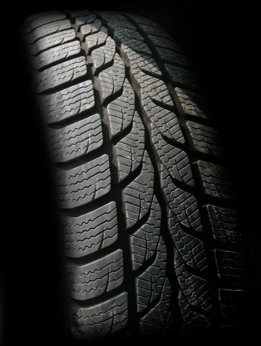 Auto Tires Rubber close-up in the dark