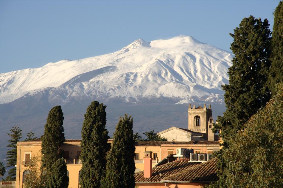 building with mountains in the background in italy