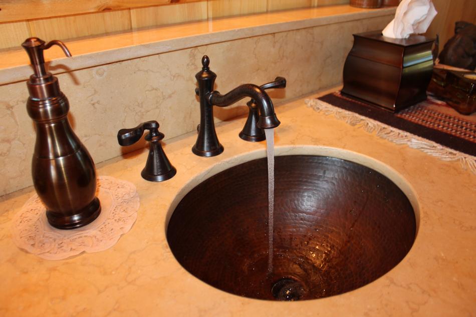 Close-up of the copper sink, in the bathroom