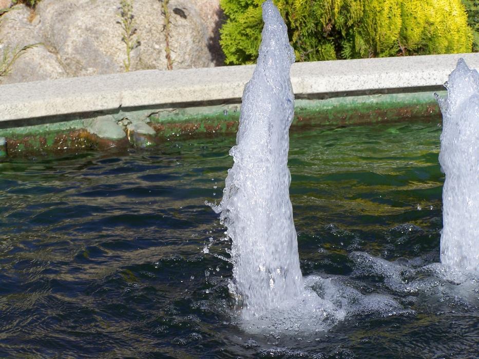 water jet in the fountain in the park