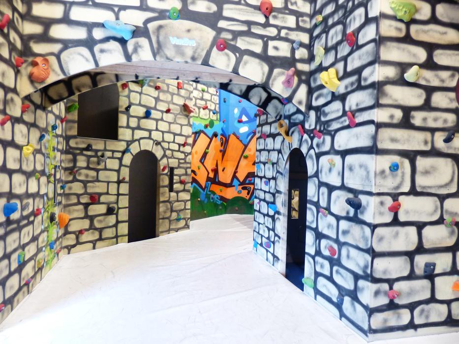 climbing walls in a castle-like hall