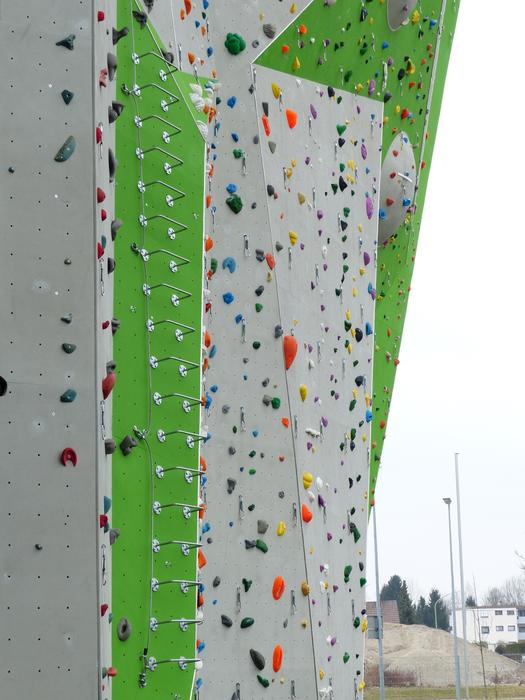 Colorful climbing wall with ropes, outdoors