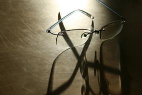 glasses are reflected on the table surface
