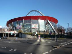 Landscape with Lanxessarena in Cologne, Germany, under the blue sky