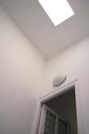 white light on the ceiling in front of the door