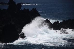 foamy waves on the rocky coast of Jeju island