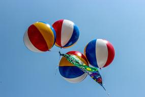 colored balloons fly in the sky