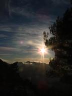 bright sun in the clouds in the evening