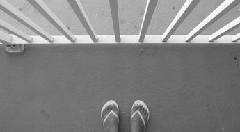 flip flops feet balcony