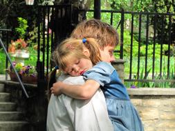 Kid hugs Dad