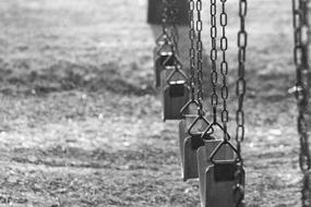 swing with chains in the park in black and white background