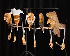 Puppets with faces, on the stand in the theater