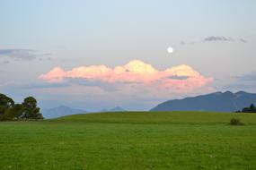 Beautiful landscape of the mountains with plants, in Bavaria, Germany, at colorful and beautiful sunset with clouds