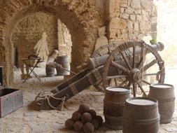 cannon and cannonballs in a medieval fortress