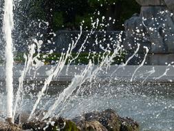 Water fountain in sunlight, in the Mirabell Gardens in Salzburg, Austria