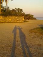 play of shadows on the beach at sunset