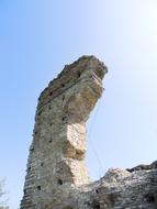 Arch of the ruin in sunlight, under the blue sky