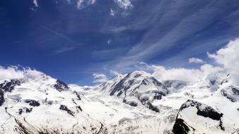Clouds and snowy Alps