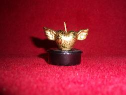 golden heart with wings as a candle