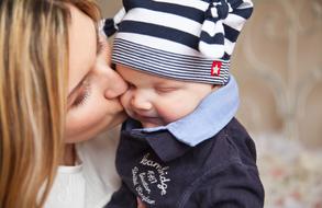 Mom Kissing Her Baby
