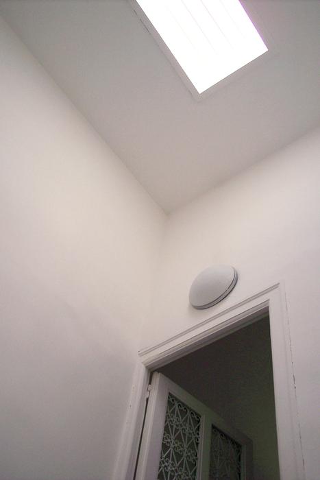 white light on the ceiling in front of the door