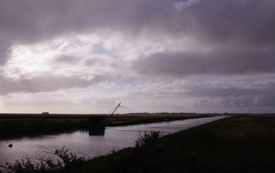Beautiful landscape with the river in VendÃ©e, France, under the clouds