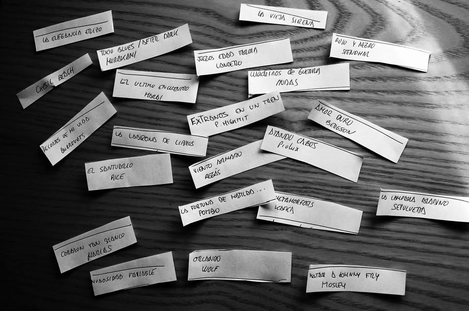 tags with the names of books on the table