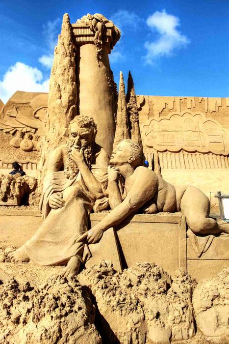 sand sculptures against the blue sky