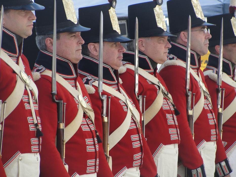 uniformed guards with weapons