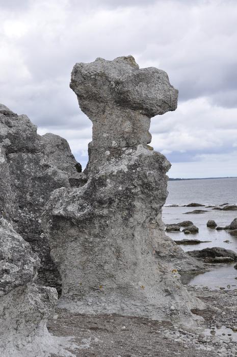 Stone sea stack on the coast in Gotland, under the clouds