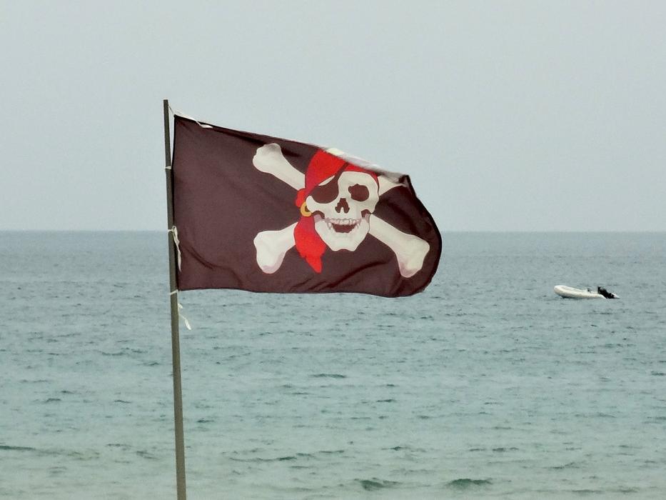 brown pirate flag on sea background