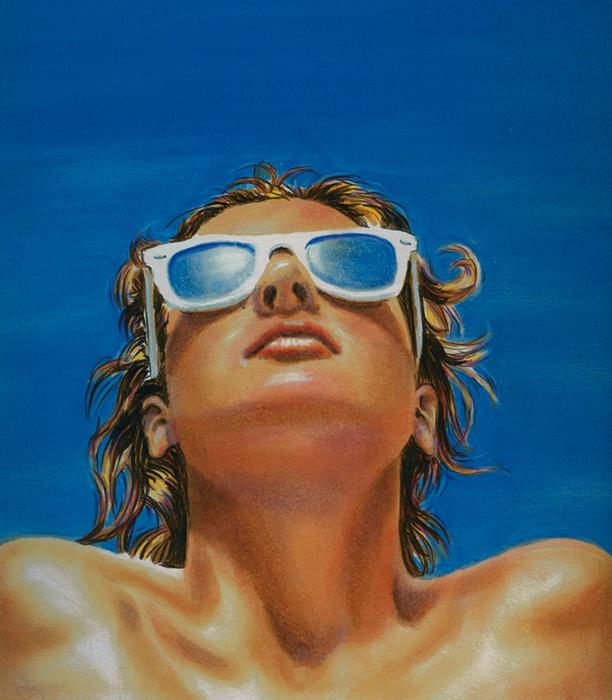 tanned girl in blue sunglasses looking up