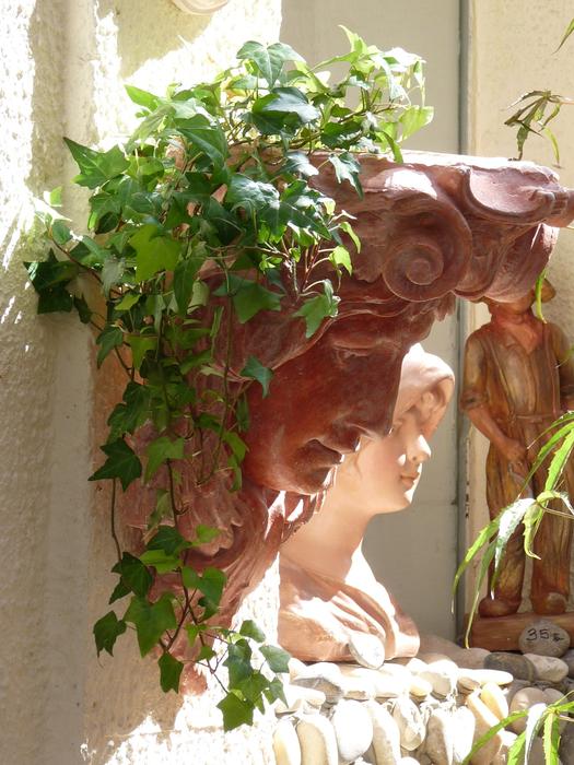 plant in pot in the form of a woman's head