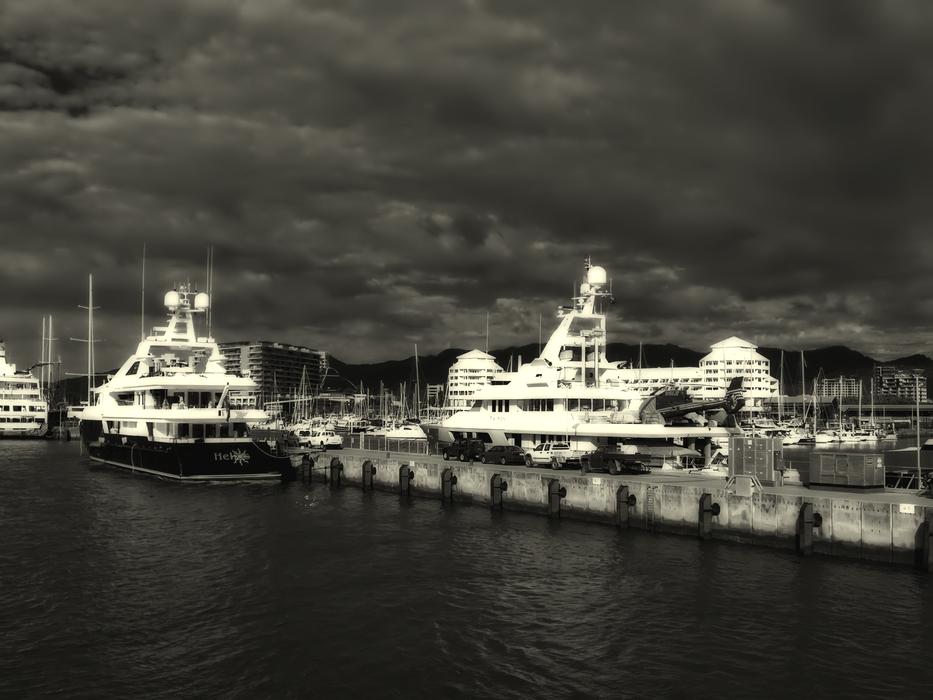black and white photo of ships in the port of australia