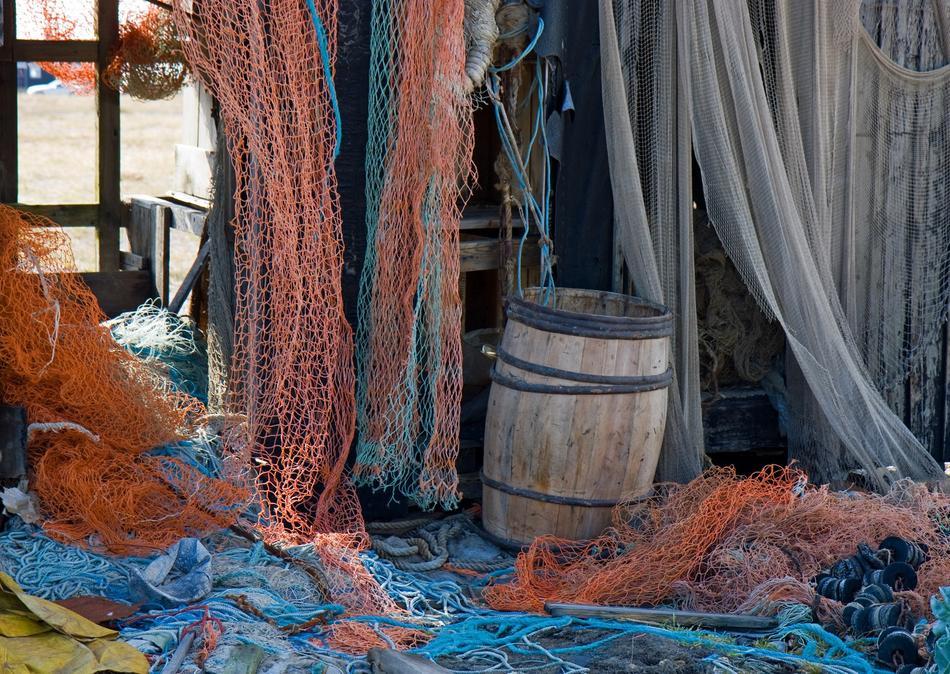 picturesque Old Fishing Nets beneath shed