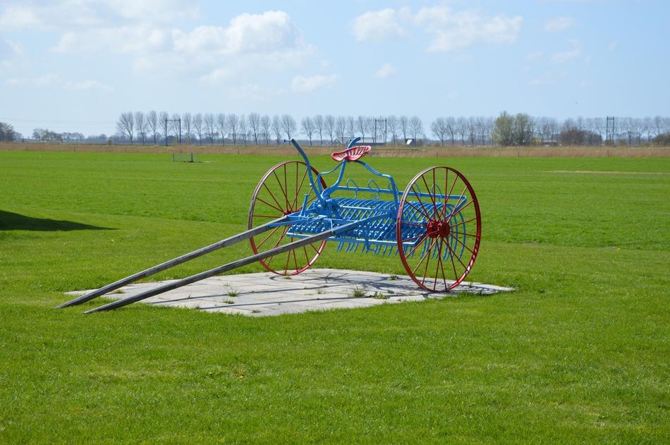 horse drawn hay rake, Agriculture Machine at rural landscape