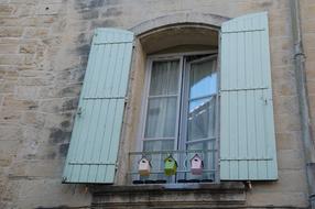 facade with open wooden shutters