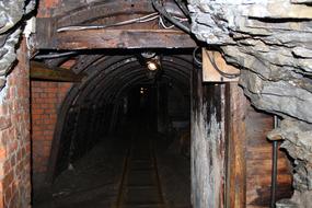 Colorful mining tunnel in light and darkness